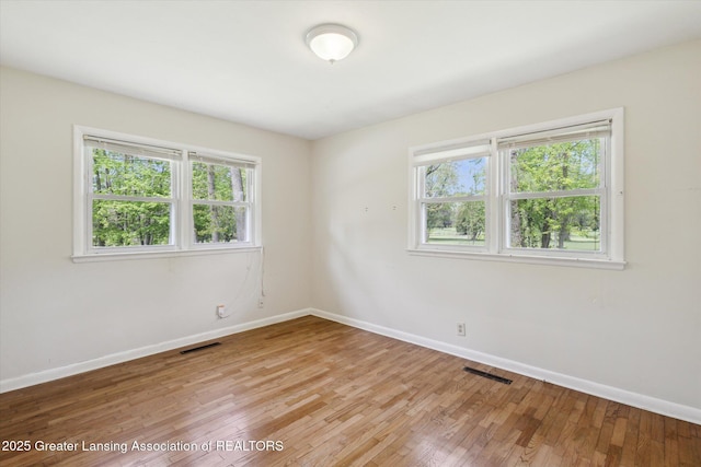 4793 Ottawa Dr, Okemos, MI 48864 - unfurnished room with baseboards and light wood-style flooring
