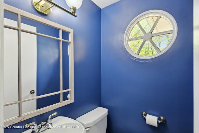 4793 Ottawa Dr, Okemos, MI 48864 - half bathroom featuring toilet and a sink