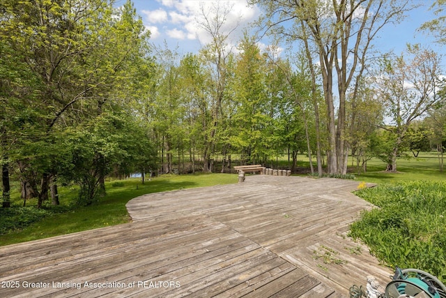 4793 Ottawa Dr, Okemos, MI 48864 - wooden deck with a yard and view of wooded area