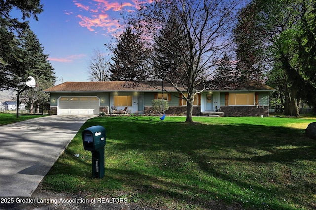 single story home with concrete driveway, a front yard, an attached garage, and stone siding