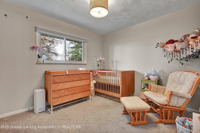 carpeted bedroom with baseboards
