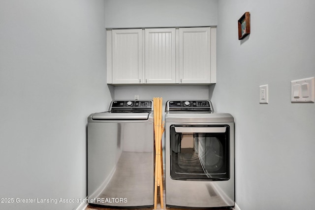 laundry room with baseboards, cabinet space, and independent washer and dryer