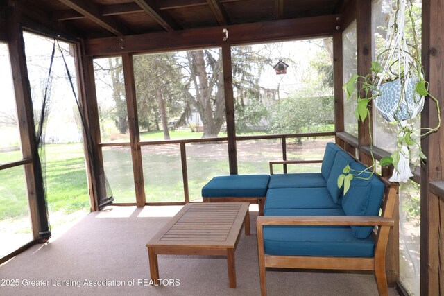 sunroom / solarium with a wealth of natural light and outdoor lounge area