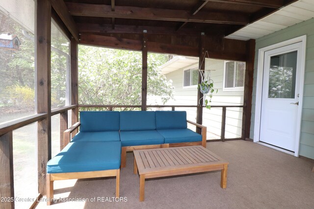 sunroom featuring outdoor lounge area