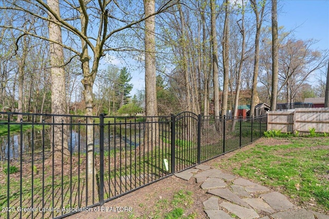 view of gate with fence