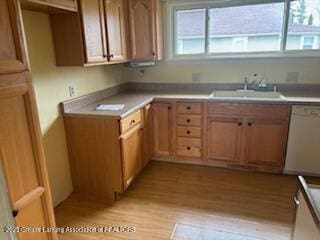 512 S Cedar St, Owosso, MI 48867 - kitchen featuring a sink and light wood finished floors