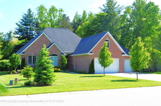 3401 N Burwick Dr, Port Huron, MI 48060 - view of front of home with brick siding, a front yard, concrete driveway, and an attached garage