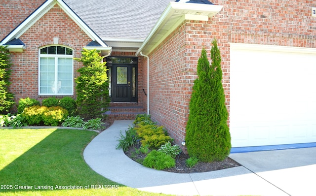 3401 N Burwick Dr, Port Huron, MI 48060 - property entrance featuring brick siding, roof with shingles, a lawn, and a garage