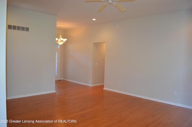 3401 N Burwick Dr, Port Huron, MI 48060 - empty room with a chandelier, wood finished floors, a ceiling fan, baseboards, and recessed lighting