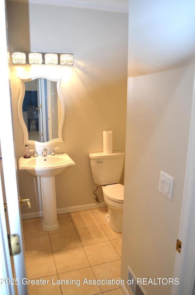 3401 N Burwick Dr, Port Huron, MI 48060 - bathroom with tile patterned floors, toilet, and baseboards