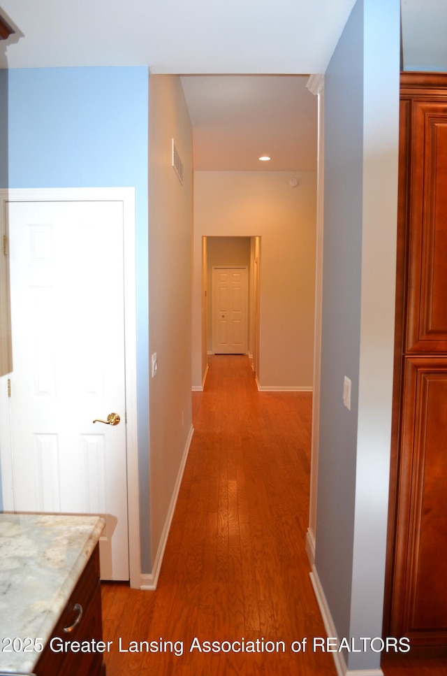 3401 N Burwick Dr, Port Huron, MI 48060 - hallway featuring light wood-style floors, baseboards, and recessed lighting