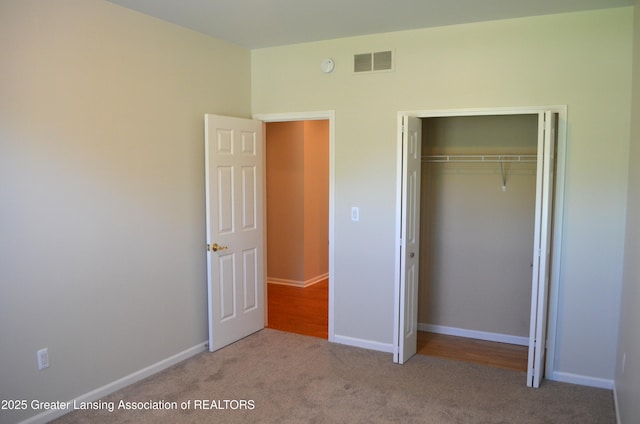 3401 N Burwick Dr, Port Huron, MI 48060 - unfurnished bedroom with a closet, carpet flooring, and baseboards