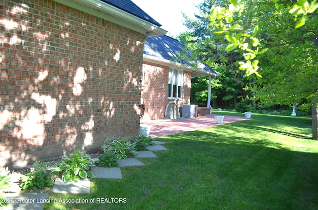 3401 N Burwick Dr, Port Huron, MI 48060 - view of green lawn featuring a patio area
