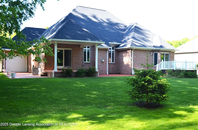 3401 N Burwick Dr, Port Huron, MI 48060 - rear view of property with brick siding, an attached garage, a lawn, and a porch