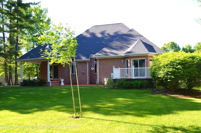 3401 N Burwick Dr, Port Huron, MI 48060 - view of front of house featuring brick siding, a front lawn, and a shingled roof
