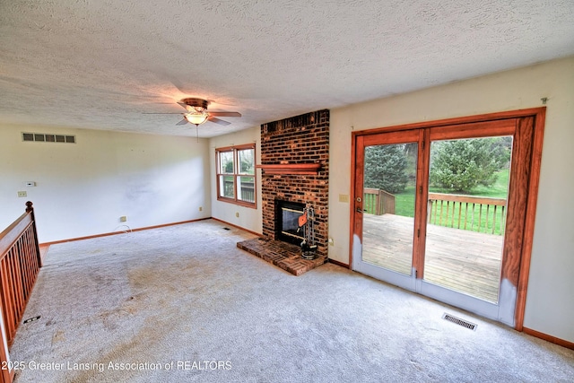9408 W Scenic Lake Dr, Laingsburg, MI 48848 - unfurnished living room with a ceiling fan, baseboards, visible vents, and carpet