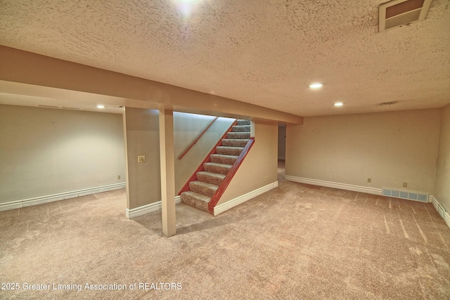 9408 W Scenic Lake Dr, Laingsburg, MI 48848 - finished below grade area with visible vents, recessed lighting, a textured ceiling, and carpet floors