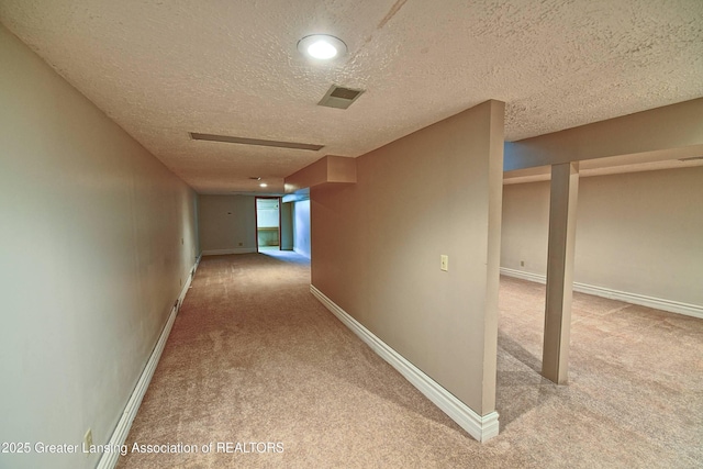 9408 W Scenic Lake Dr, Laingsburg, MI 48848 - hall featuring carpet floors, a textured ceiling, baseboards, and visible vents
