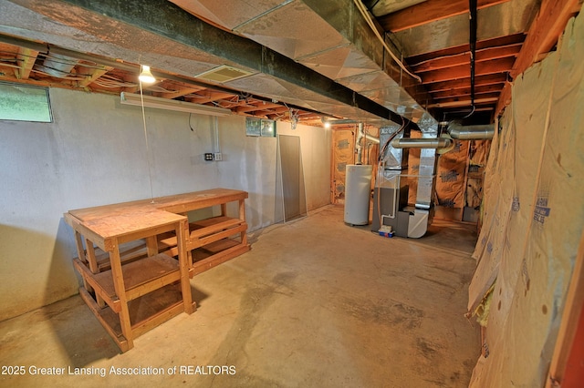9408 W Scenic Lake Dr, Laingsburg, MI 48848 - basement featuring visible vents, heating unit, gas water heater, and a wealth of natural light
