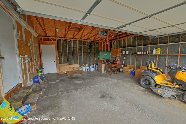 9408 W Scenic Lake Dr, Laingsburg, MI 48848 - garage with a garage door opener