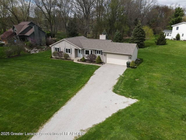 9408 W Scenic Lake Dr, Laingsburg, MI 48848 - ranch-style home featuring a garage, a chimney, a front yard, and aphalt driveway
