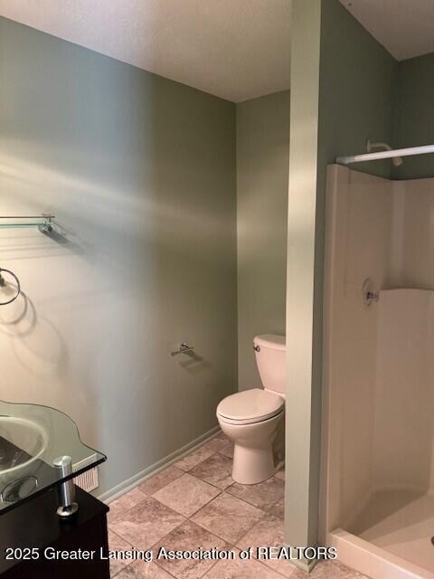 2434 Emerald Lake Dr, East Lansing, MI 48823 - full bathroom with a shower stall and vanity