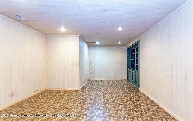 8505 W Willow Hwy, Grand Ledge, MI 48837 - unfurnished room with wooden walls, baseboards, recessed lighting, and ornamental molding