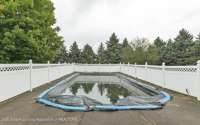 8505 W Willow Hwy, Grand Ledge, MI 48837 - view of pool with a fenced backyard and view of scattered trees
