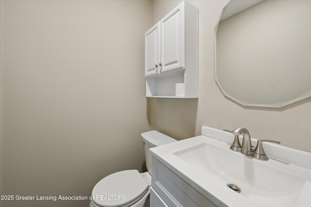 half bath with vanity and toilet