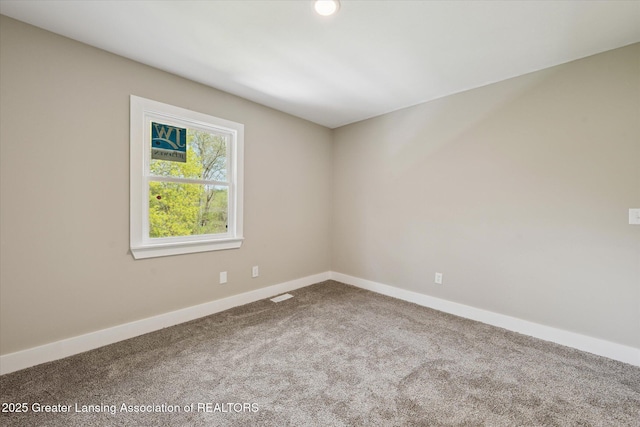 carpeted spare room featuring baseboards, recessed lighting, and visible vents