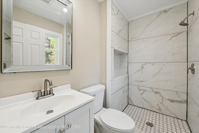 bathroom with vanity, toilet, and a shower stall