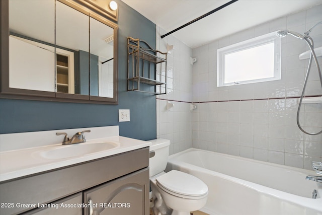 bathroom featuring vanity, toilet, and tub / shower combination