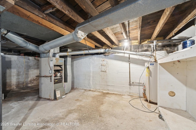 unfinished below grade area featuring heating unit and gas water heater