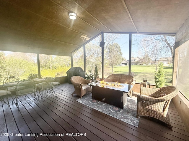 sunroom featuring an outdoor fire pit