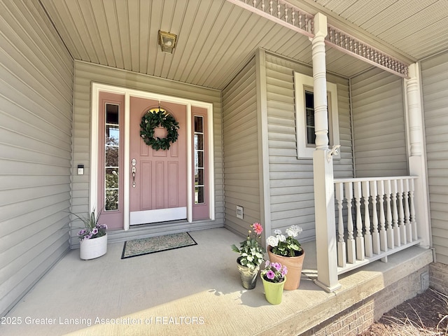 property entrance with covered porch
