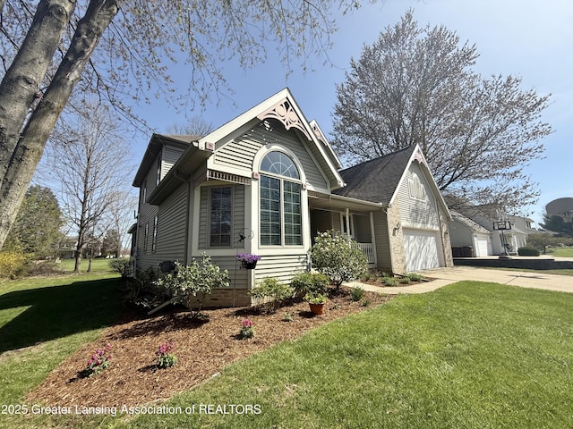 view of front of home with a garage, a front lawn, and concrete driveway