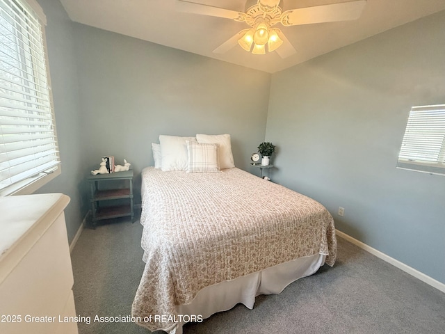 carpeted bedroom featuring a ceiling fan and baseboards