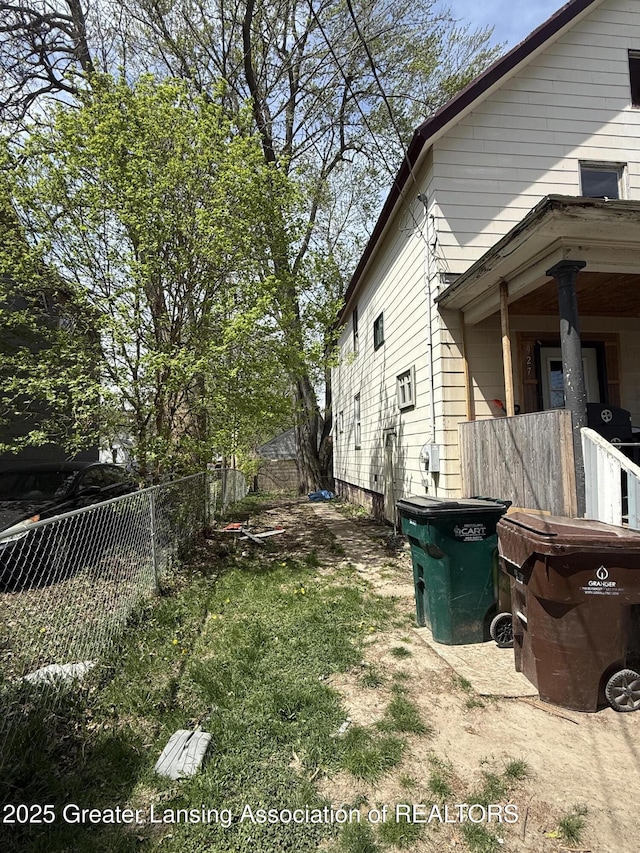 view of side of property with fence