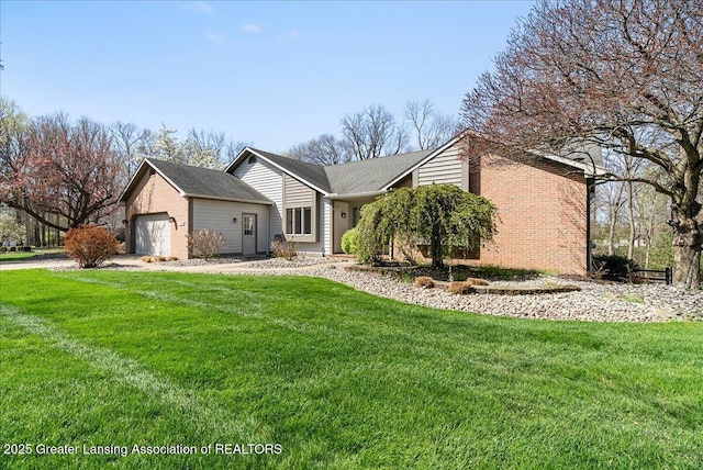 view of front facade featuring a garage, a front lawn, and brick siding