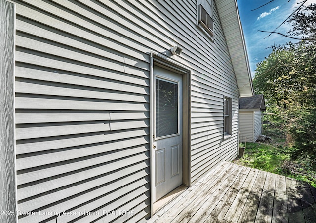 property entrance with a deck