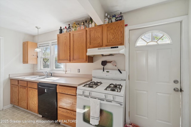kitchen featuring black dishwasher, white gas range, light countertops, under cabinet range hood, and a sink