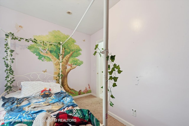 carpeted bedroom featuring baseboards