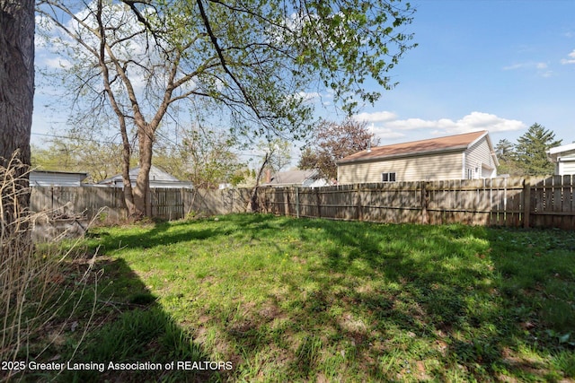 view of yard featuring a fenced backyard