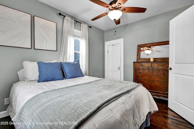 bedroom with a ceiling fan and wood finished floors