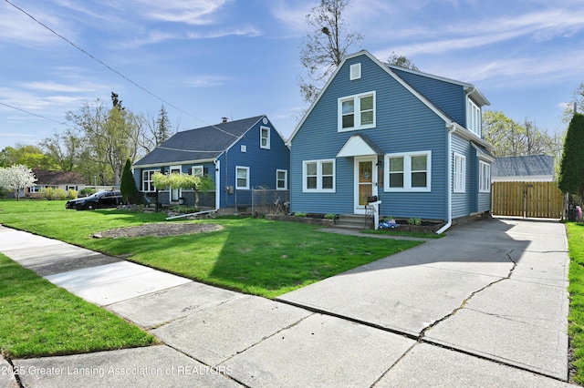 bungalow with driveway and a front yard