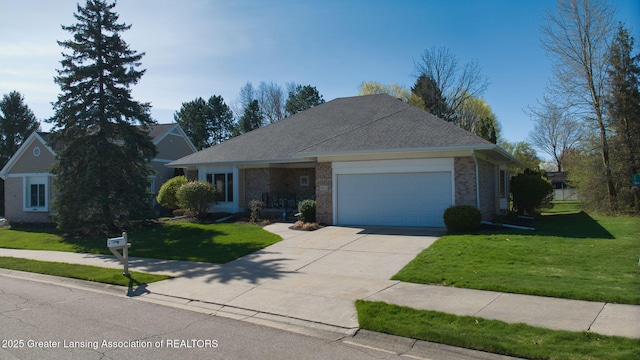ranch-style home with a shingled roof, an attached garage, brick siding, a front yard, and driveway