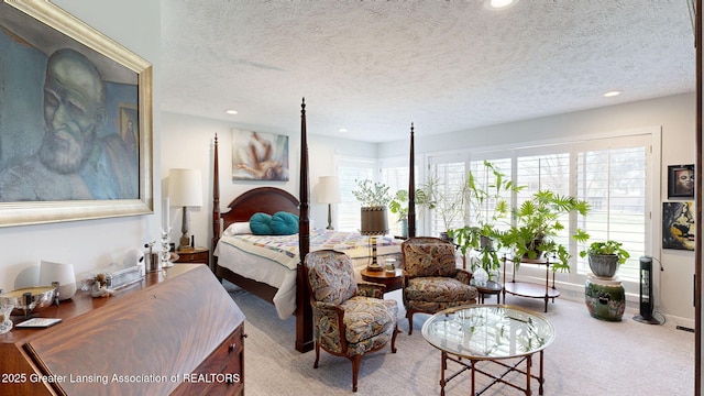 bedroom with recessed lighting, a textured ceiling, and carpet