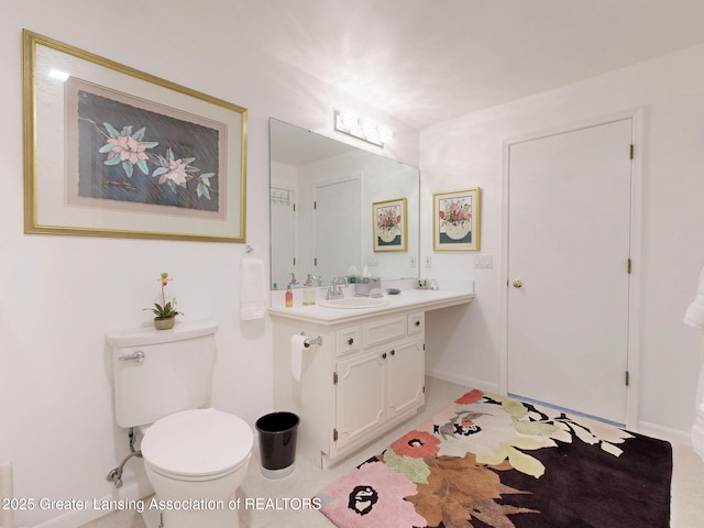 bathroom with toilet and vanity