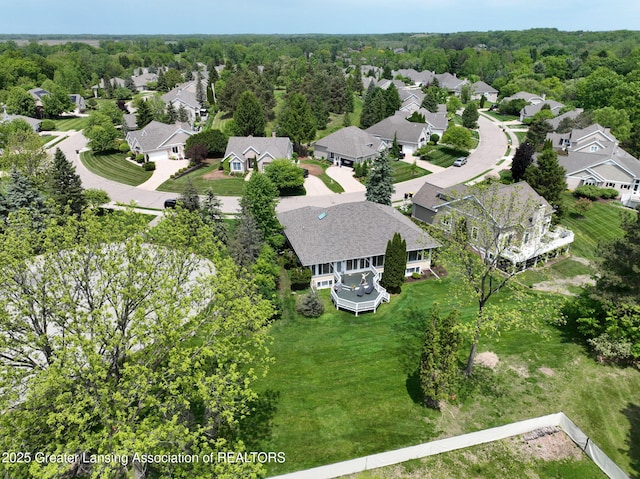 6074 E Longview Dr, East Lansing, MI 48823 - aerial view of residential area with a heavily wooded area