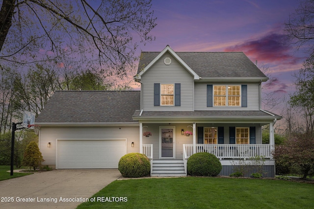 view of front of house featuring a garage, a front yard, roof with shingles, a porch, and driveway